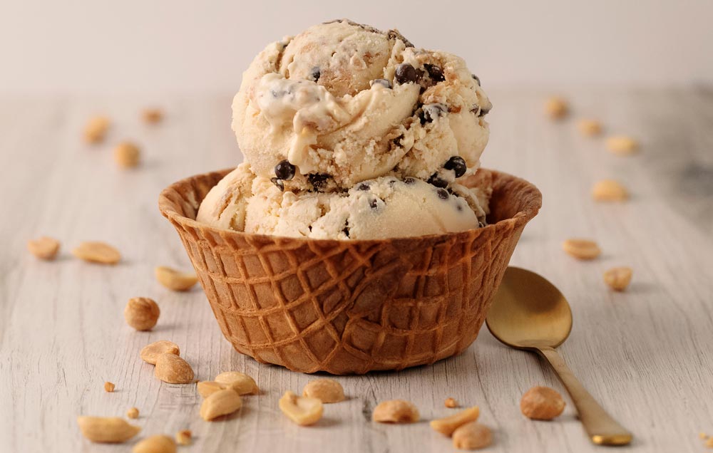 ice cream in a waffle cup with a spoon